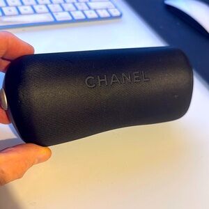 Black Chanel sunglasses case.